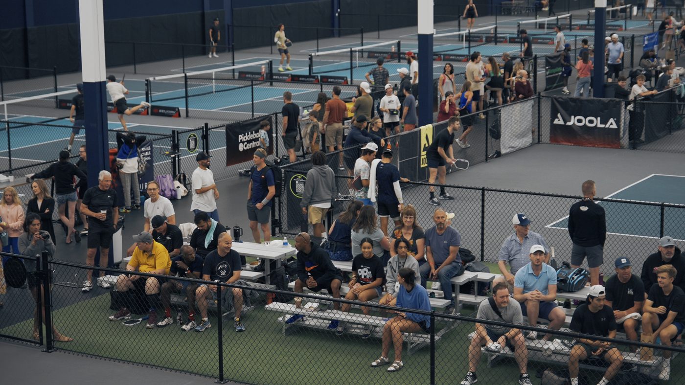 Spectators watching matches from courtside seating